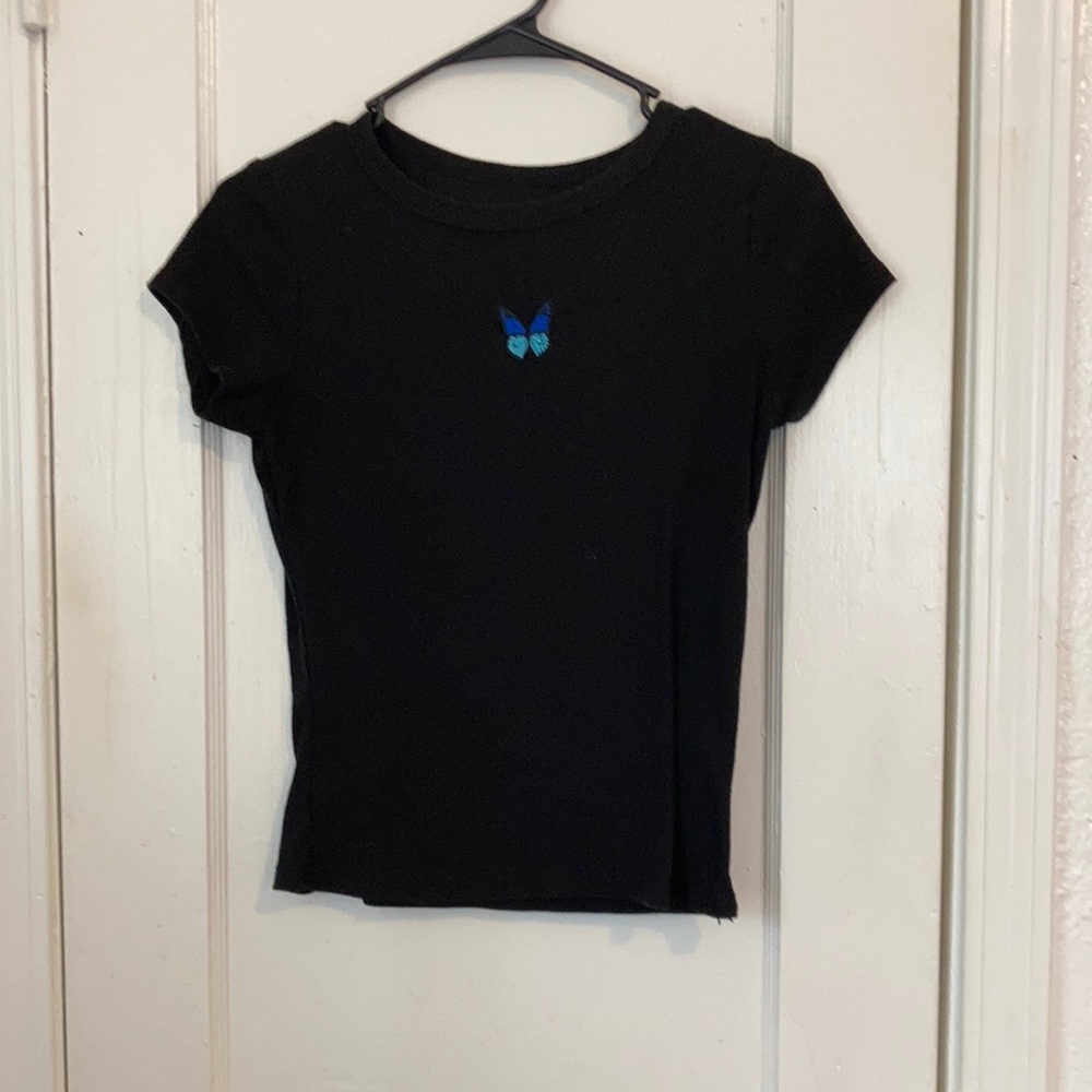 Blue butterfly in a black space tee